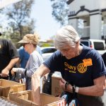 Volunteers at Interfaith Community Services' backpack drive last month. The nonprofit received a portion of Carlsbad's federal grant money for public service activities. Courtesy photo/Interfatih