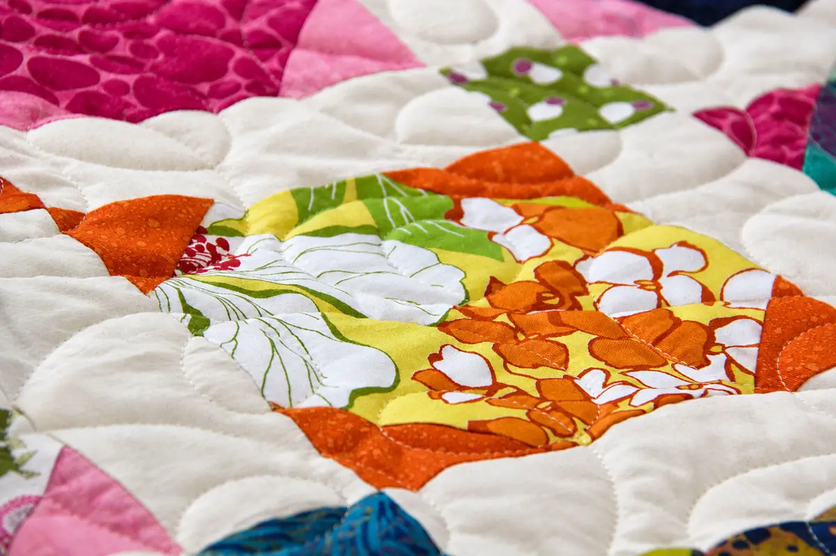 Intricate quilt patterns stitched by Julian Union High School students are displayed during Eleanor Burns’ quilting class in Julian. Photo by Samantha Nelson