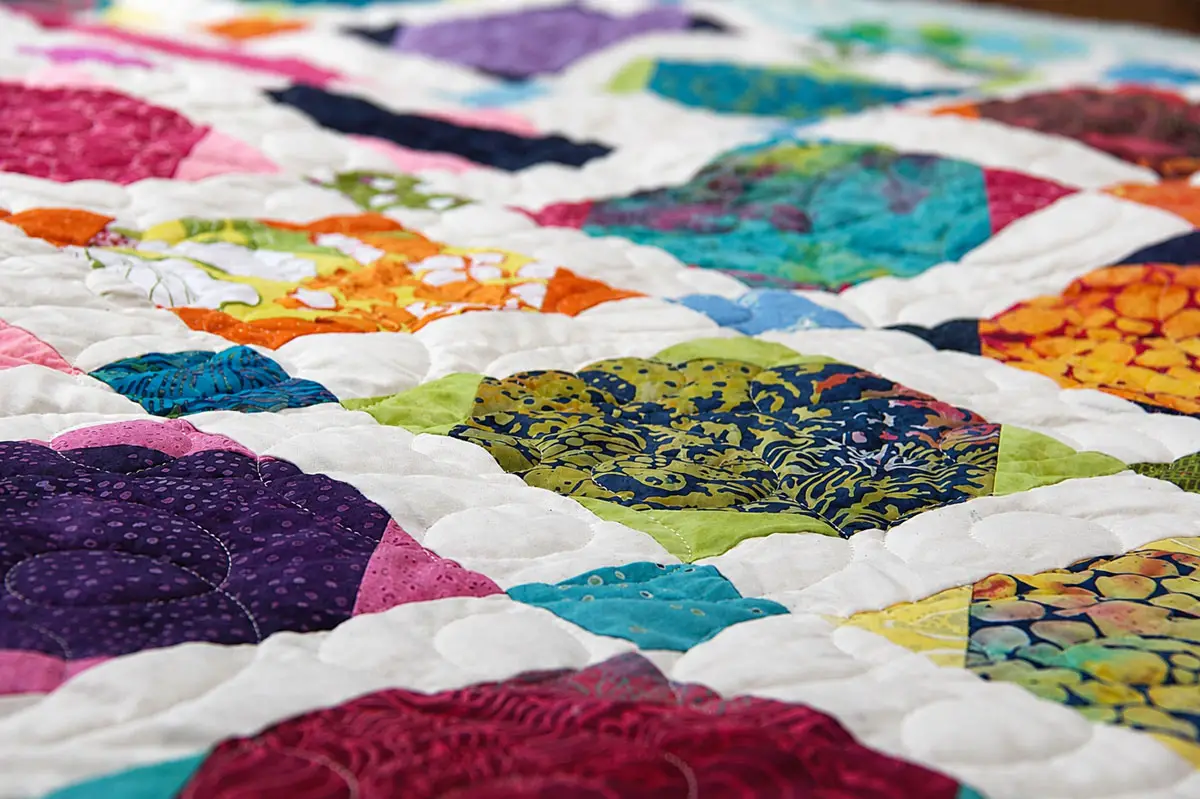 Close-up of colorful quilt patches created by Julian Union High School students during a yearlong quilting workshop led by master quilter Eleanor Burns in Julian. Photo by Samantha Nelson