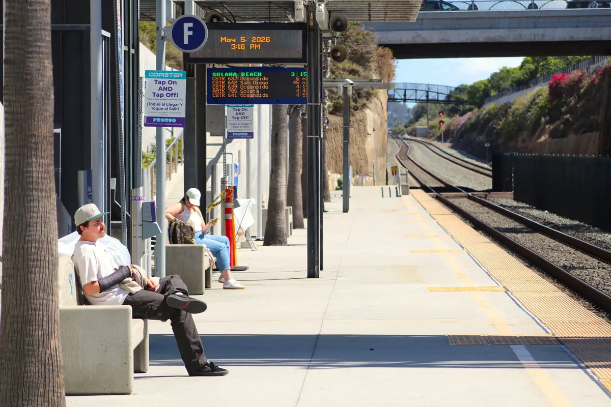 Passengers wait for their train on Tuesday at the Solana Beach Transit Center. Photo by Leo Place