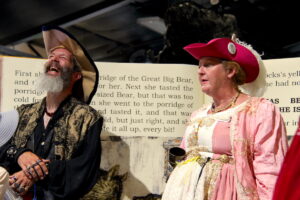 Two adults dressed as pirates.