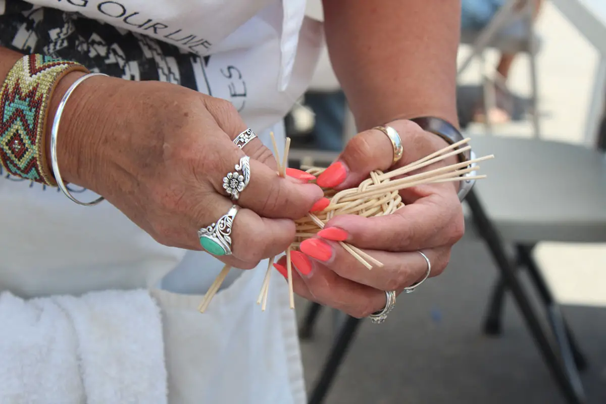 A booth teaches basket weaving to attendees of the 26th Annual Inter-tribal Powwow at the Mission San Luis Rey in Oceanside. Photo by Samantha Nelson