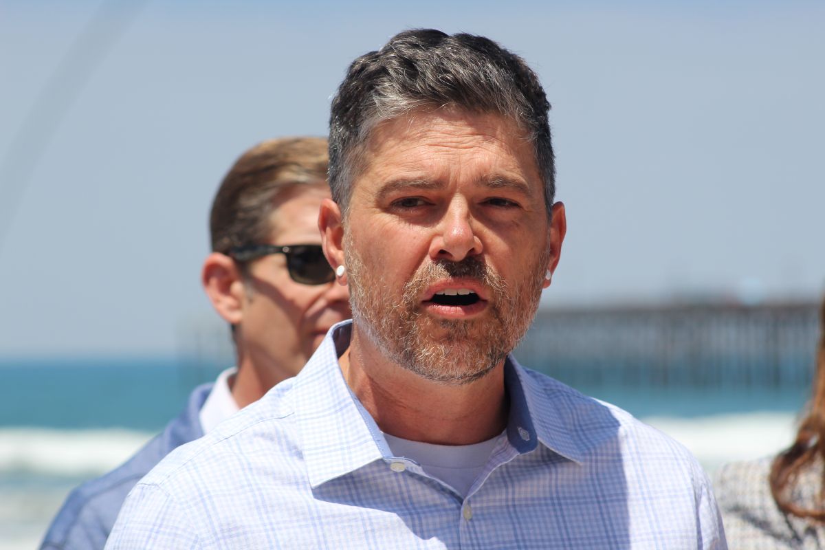 Oceanside Deputy Mayor Eric Joyce speaks at a press conference announcing completion of the harbor's dredging and a long-term sand nourishment plan for the city. Photo by Samantha Nelson