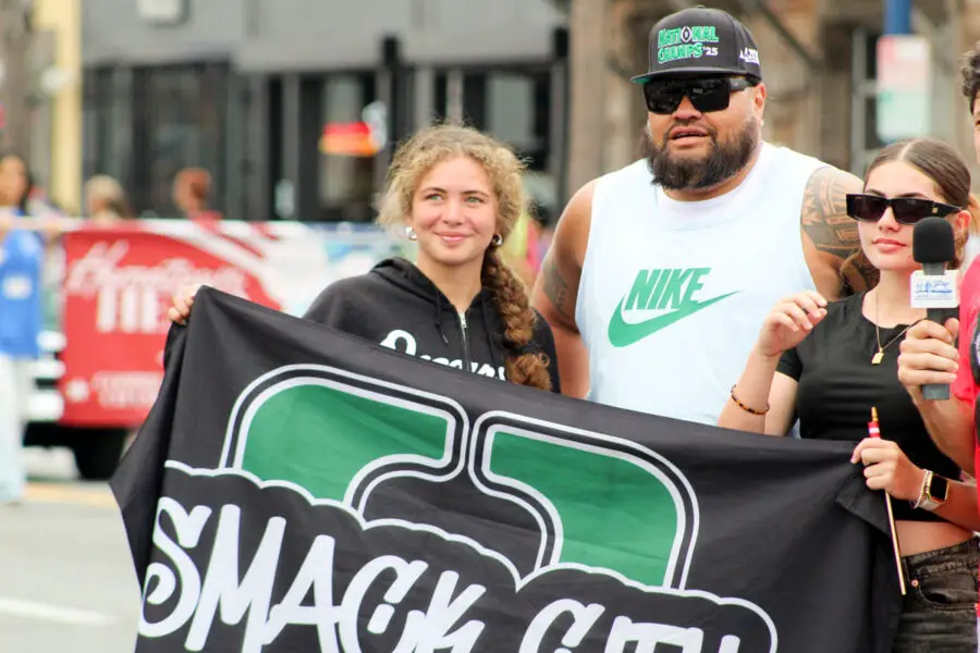 Members of Oceanside's Smack City Pop Warner team march in the 2026 Oceanside Independence Day Parade on June 27. Oceanside Pop Warner served as this year's parade grand marshal. Photo by Samantha Nelson