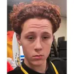 A boy with red curly hair