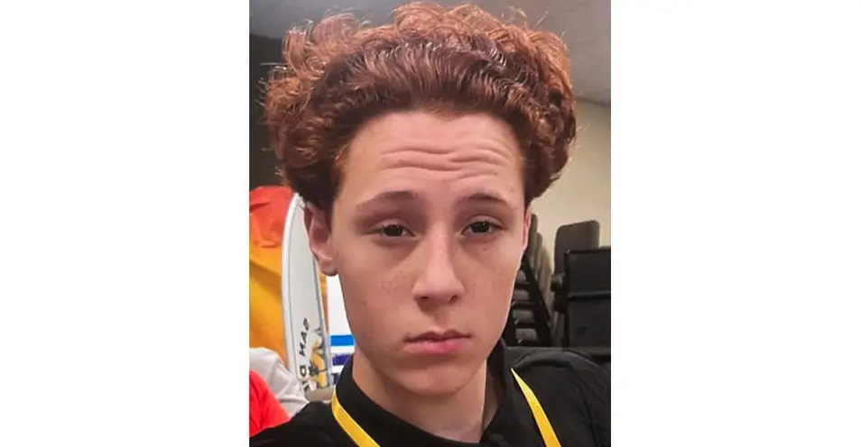 A boy with red curly hair