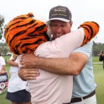 Auburn coach hugs mascot