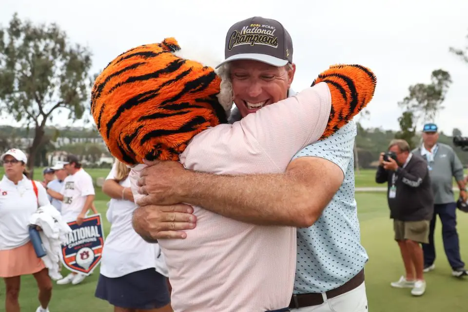 Auburn coach hugs mascot