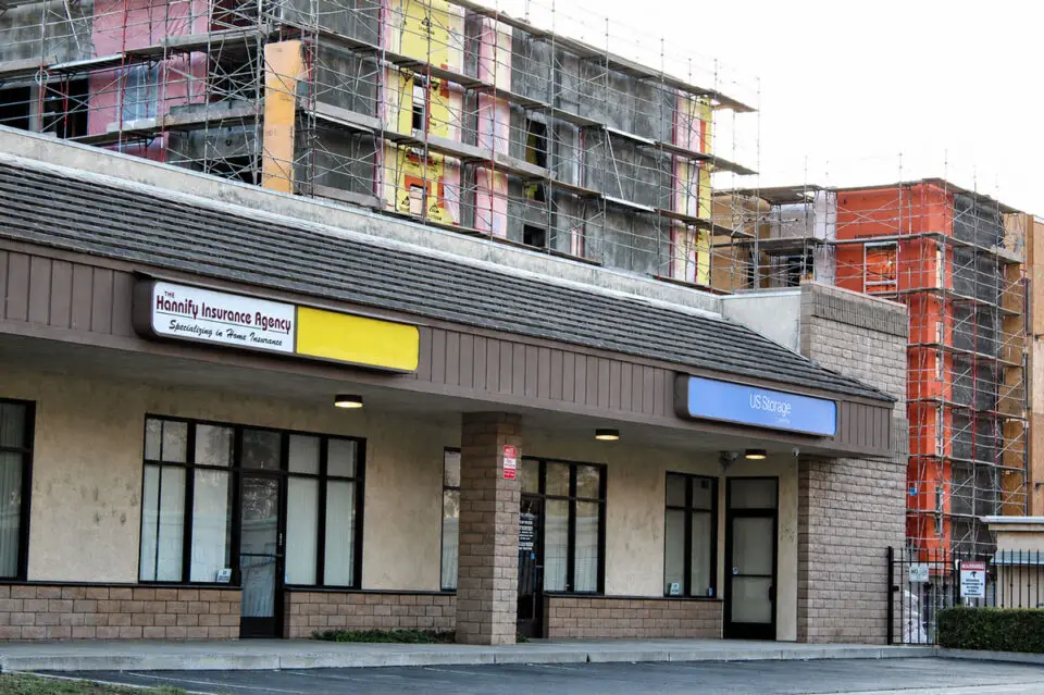 The former Hannify Insurance building and adjacent U.S. Storage facility on W. Valley Parkway are slated for demolition to make way for a 94-unit townhome development. Photo by Samantha Nelson