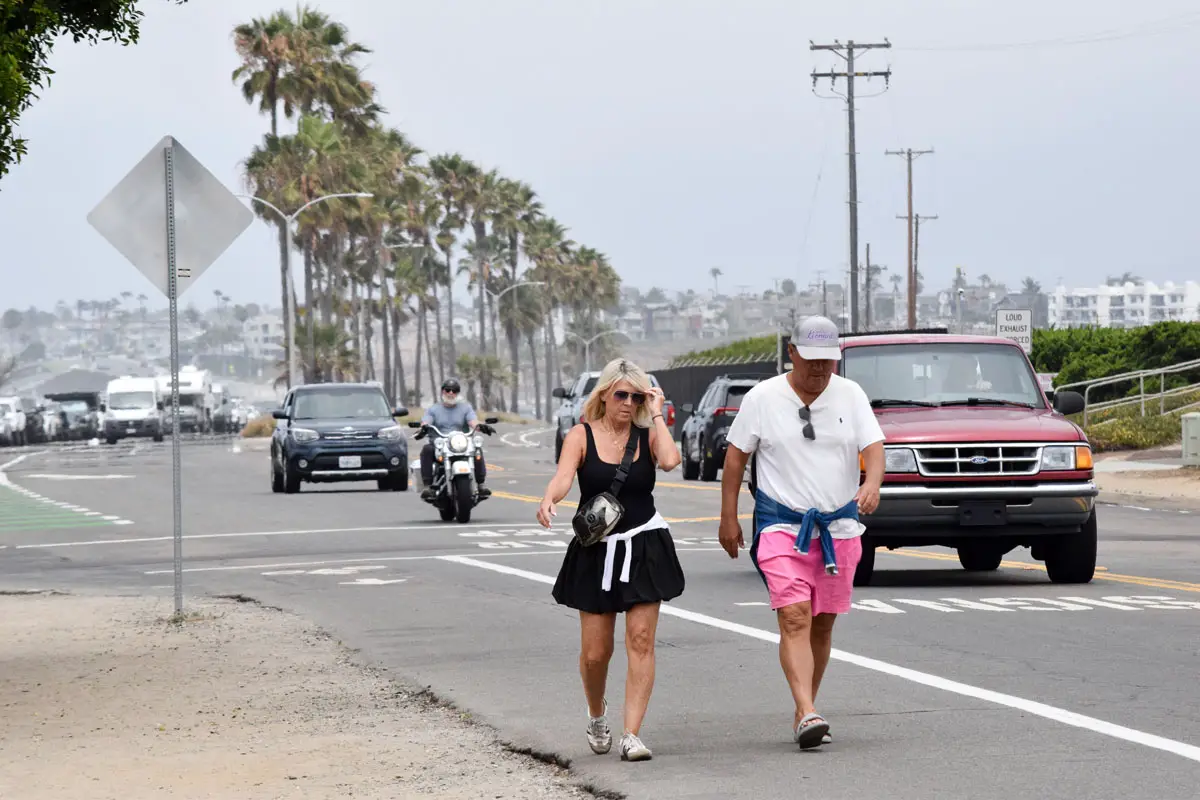 Pedestrians walk along Carlsbad Boulevard on June 16 near Terramar neighborhood. Photo by Summer Hu