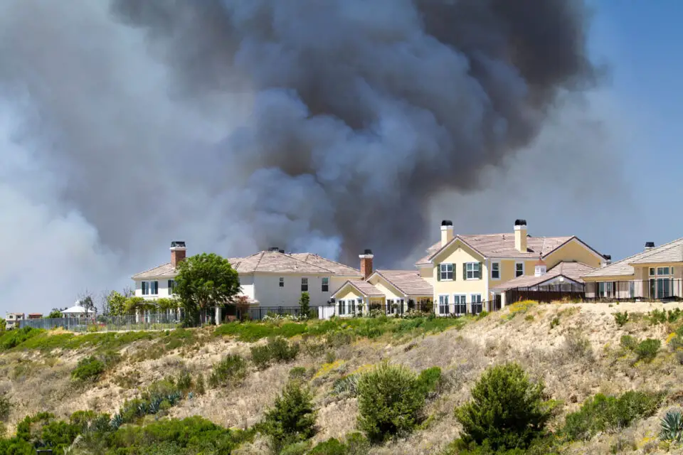 A brush fire burns near a Carlsbad neighborhood in 2014. Photo by Malisa Nicolau