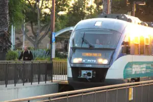 A Sprinter train arrives at a station.