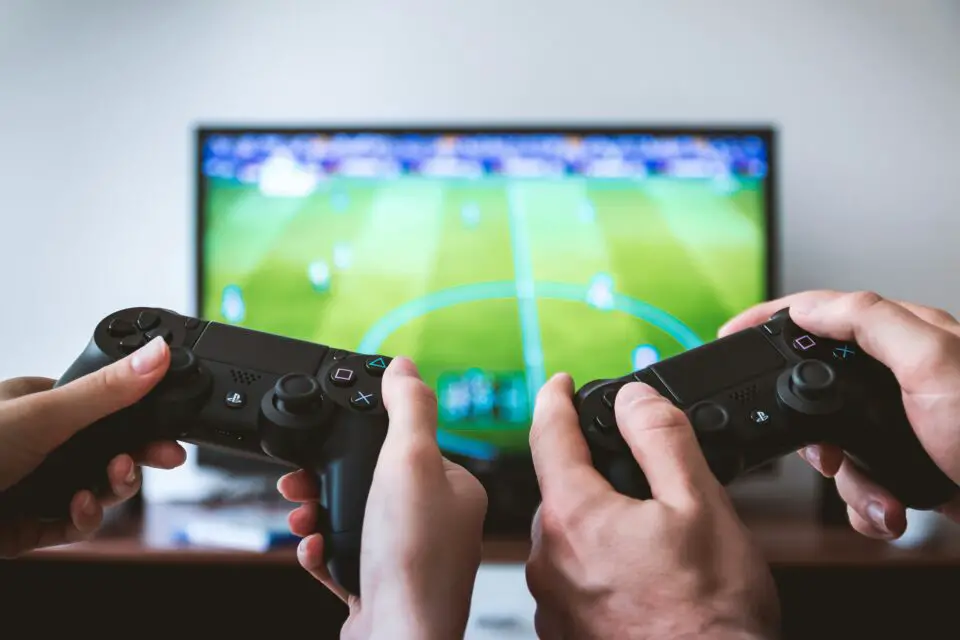 Player using a mobile device to enjoy classic games adapted for modern platforms