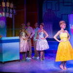 Cast members perform a scene from New Village Arts’ production of “Hairspray.” The Carlsbad theater company recently announced its 25th-anniversary season. Courtesy photo/New Village Arts