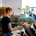 An employee works behind the counter at Kettle on Coast in downtown Oceanside. Photo by Samantha Nelson