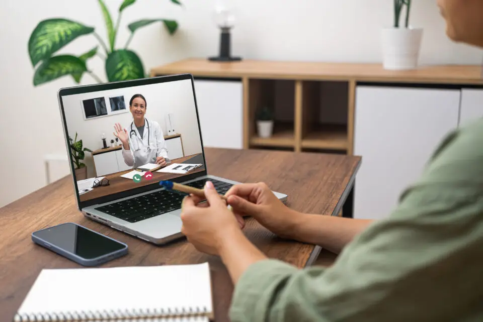 Patient speaking with a doctor during a telehealth medical consultation.