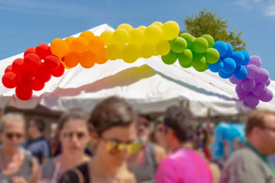 Attendees gather at a community festival during Oceanside Pride weekend in North County San Diego.
