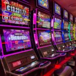 Row of colorful slot machines in a casino, illustrating online slot odds, RTP, and volatility.