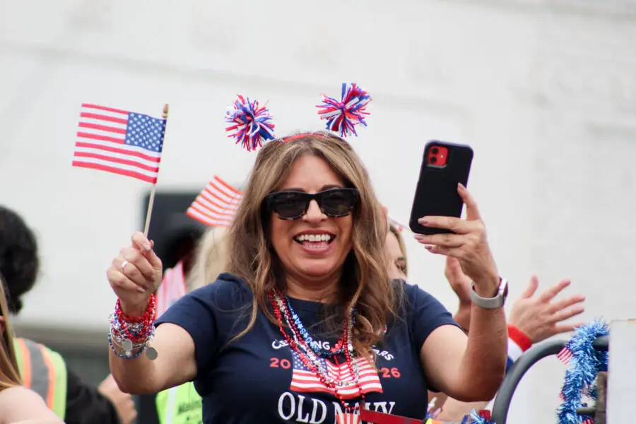 Spectators dressed in patriotic red, white and blue cheer as the 2026 Oceanside Independence Day Parade passes along Coast Highway on June 27. Photo by Samantha Nelson