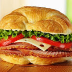 The ham sandwich at Honey Baked Ham in Encinitas, with thick slices of their signature ham layered with Swiss cheese, fresh lettuce, tomato, honey mustard and just enough mayo to tie it all together. Courtesy photo