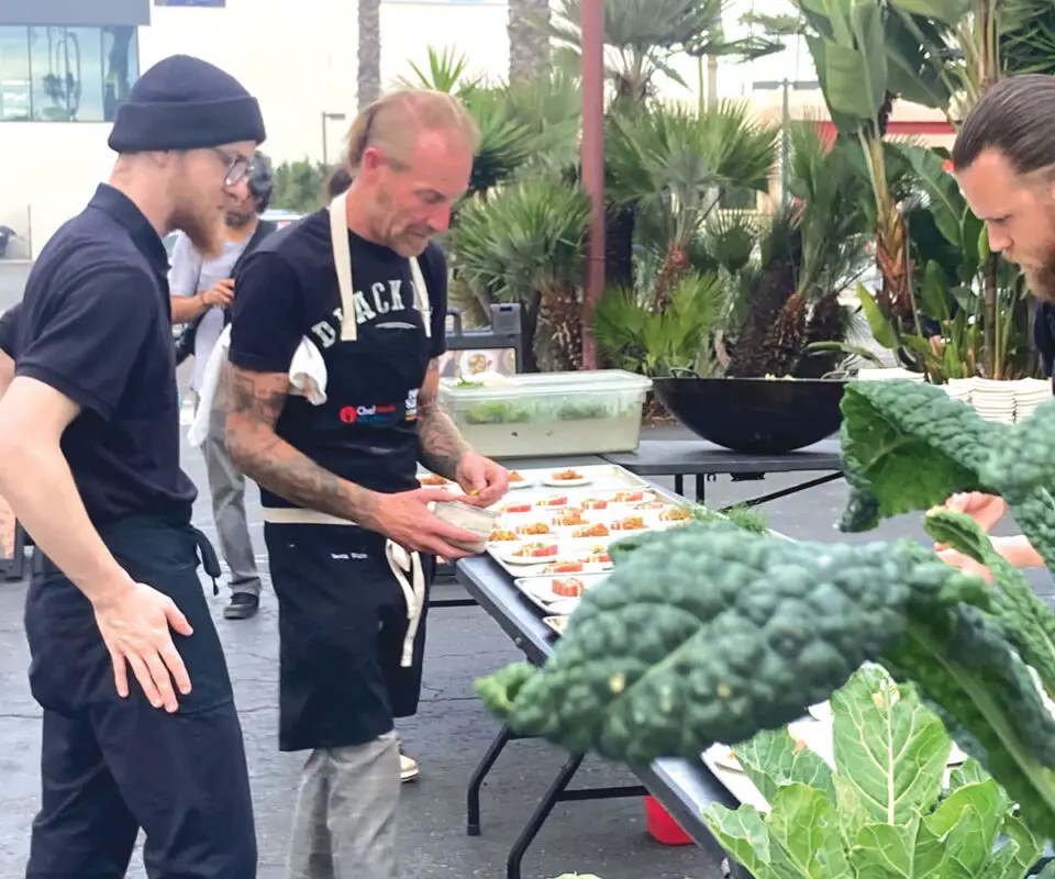 The Plot head chef and co-founder Davin Waite, center, prepares the Plantscape dinner with help from Cameron Brown and sous chef Josh Arnold. Photo by Jano Nightingale