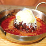 Pastaria Vivi’s firm but tender meatball made from house-ground meat mixed with panko and mozzarella cheese with pomodoro sauce. Photo by Rico Cassoni
