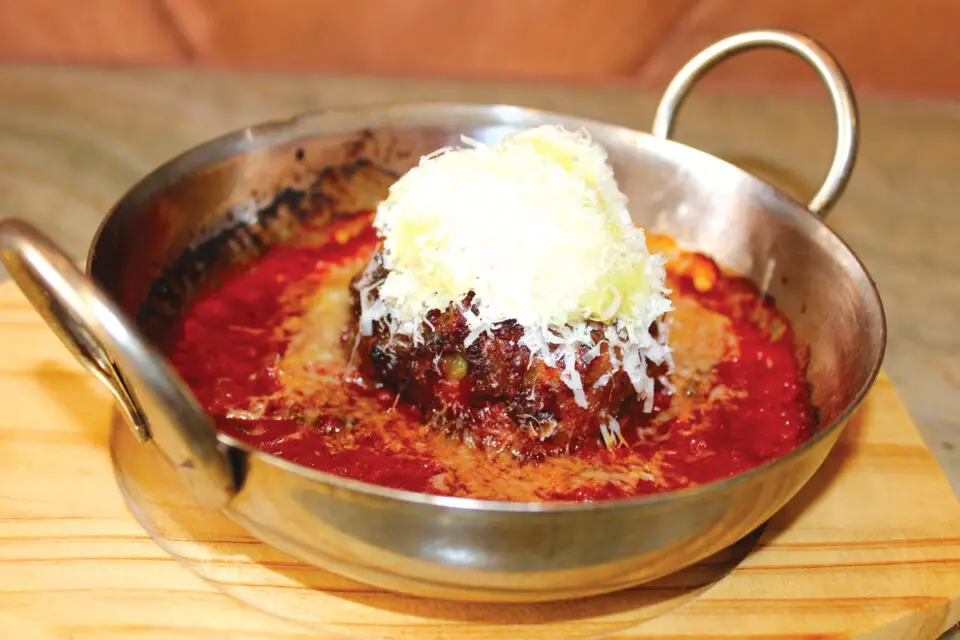 Pastaria Vivi’s firm but tender meatball made from house-ground meat mixed with panko and mozzarella cheese with pomodoro sauce. Photo by Rico Cassoni