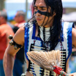 Dancers from tribes across the nation wear colorful regalia as they circle the arena during a grand entry ceremony at the 26th Annual Inter-tribal Powwow at the Mission San Luis Rey in Oceanside. Photo by Samantha Nelson