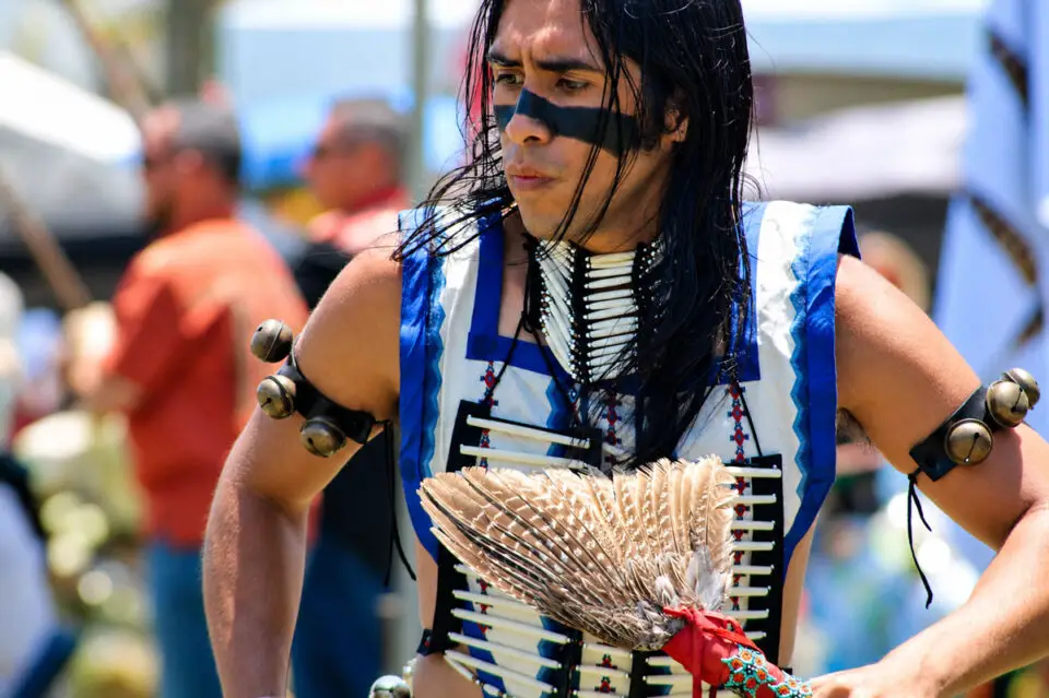 Dancers from tribes across the nation wear colorful regalia as they circle the arena during a grand entry ceremony at the 26th Annual Inter-tribal Powwow at the Mission San Luis Rey in Oceanside. Photo by Samantha Nelson