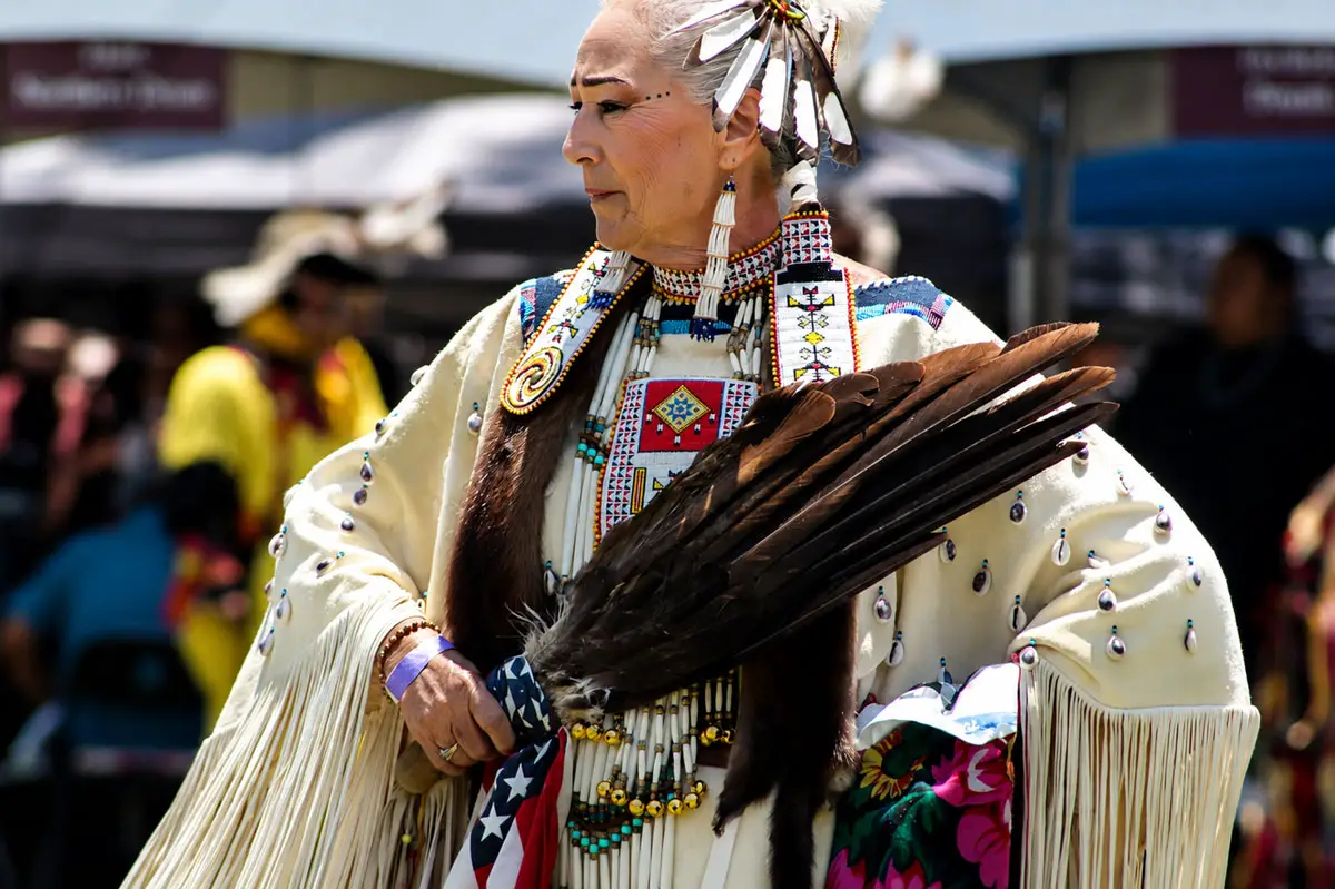 Dancers from tribes across the nation wear colorful regalia as they circle the arena during a grand entry ceremony at the 26th Annual Inter-tribal Powwow at the Mission San Luis Rey in Oceanside. Photo by Samantha Nelson