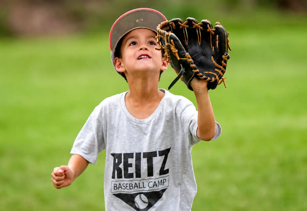 A camper prepares to make a catch during the opening week of Reitz Baseball Camp. The program welcomes players of all skill levels and emphasizes hard work, hustle and teamwork. Courtesy photo/Reitz