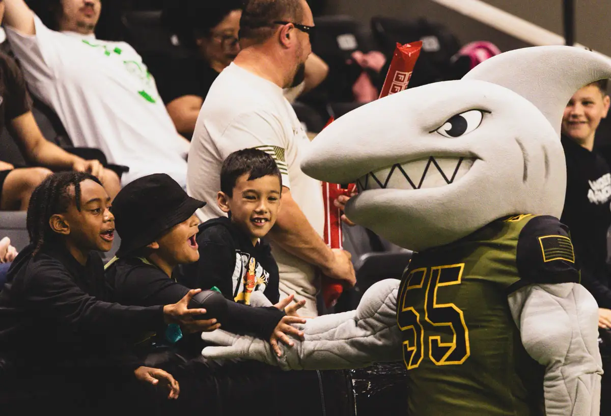 Strike Force mascot Junior shyakes hands with young fans on June 19 at Frontwave Arena. Courtesy photo/Strike Force