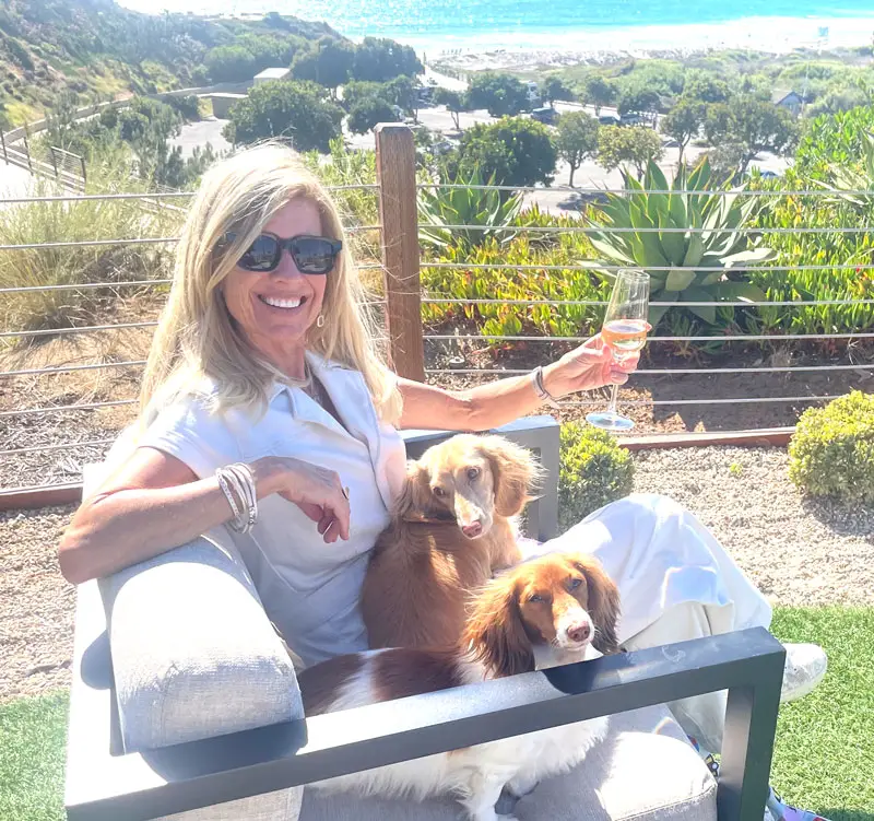 Chamber CEO Carol Knight enjoys gorgeous “Yappy Hour” views with her dogs Winnie and Frankie at VAGA, the Alila Marea Beach Resort’s stunning ocean-view restaurant and bar. Courtesy photo