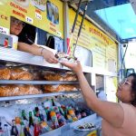 A resident buys food from Puras Papas in San Marcos in 2023. Sales tax revenue in the city is supporting several major projects and programs in the 2026-27 budget. Photo by Leo Place