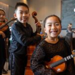 Two children with instruments