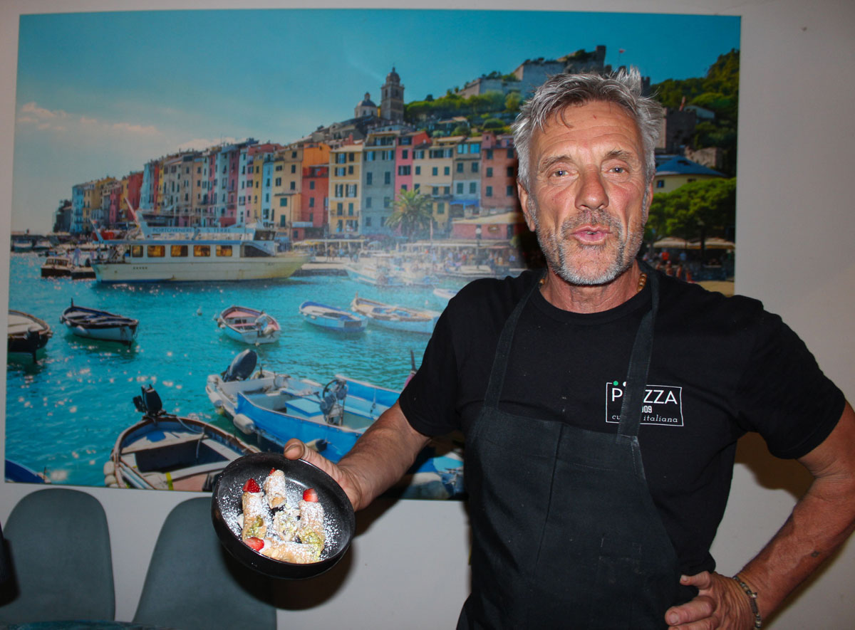 Chef Stefano presenting Cannoli Siciliana. Photo by Rico Cassoni