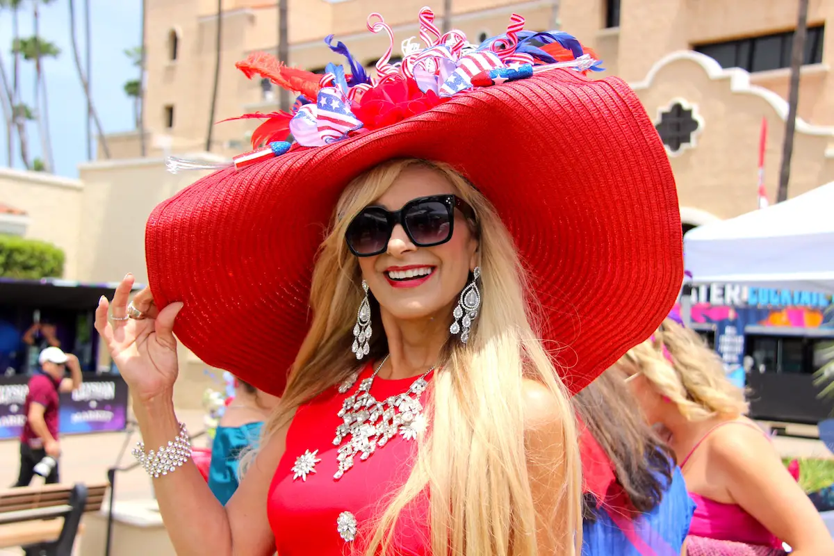 Gigi Brintwood wears a dazzling fascinator on Opening Day of the 2026 summer racing season in Del Mar. Photo by Leo Place
