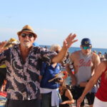 People dance on the beach