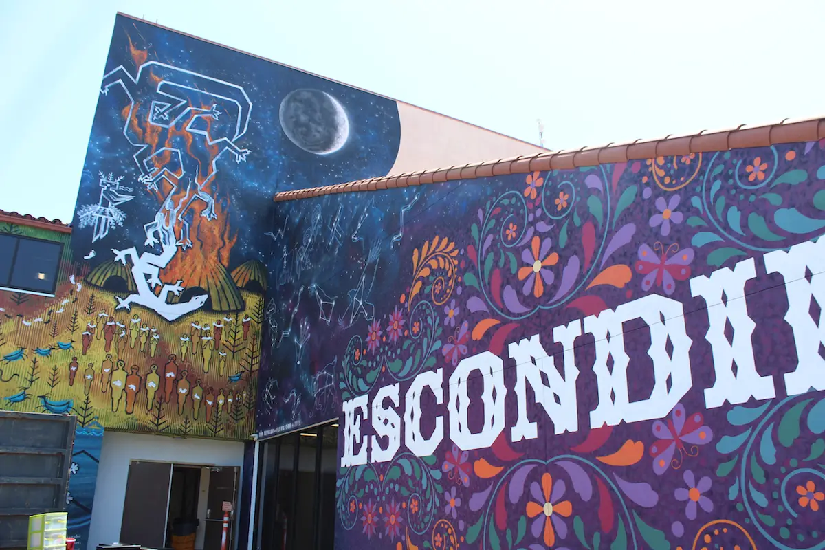 A new mural by Tim Topalov on the Second Avenue side of the Escondido Public Library depicts the Kumeyaay people's creation story. Photo by Samantha Nelson