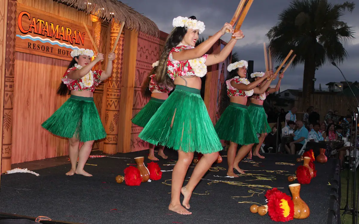 Pride of Polynesia hula dancers bringing the story of the Polynesian Islands to Catamaran Luau guests. Photo by Rico Cassoni