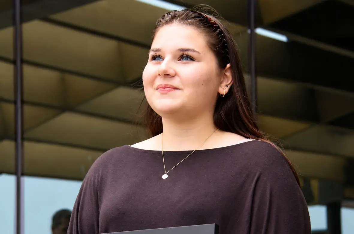 Amelia Seibert, second-place winner of The Coast News Teen Writing Contest, speaks during an awards ceremony on July 9 at the Encinitas Library. Photo by Jordan P. Ingram