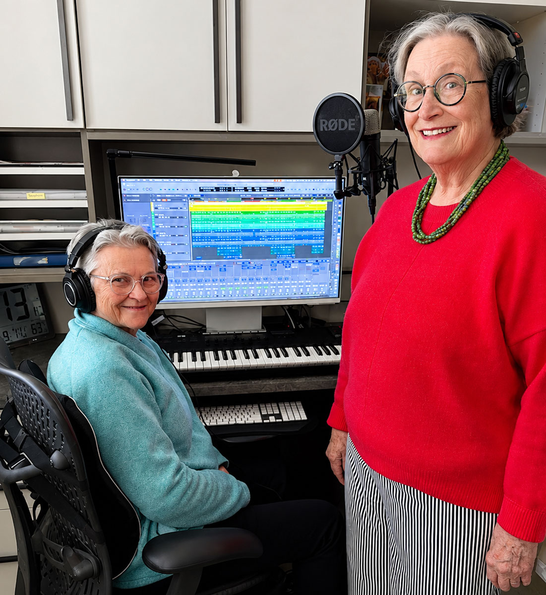 Candy Carrigan, left, and Lyn Hance work on original music in Carrigan's home studio at La Costa Glen in Carlsbad. The retirement community residents have collaborated on songwriting and recording for the past three years. Photo by Cameron Adams