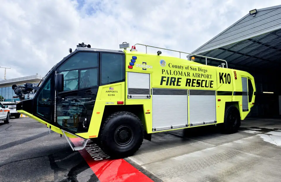An Oshkosh Striker 1500 Global aircraft rescue and firefighting vehicle sits on the tarmac at McClellan-Palomar Airport in Carlsbad. Photo by Ryan Grothe