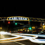 The iconic Carlsbad sign glows at night in the Village. File photo
