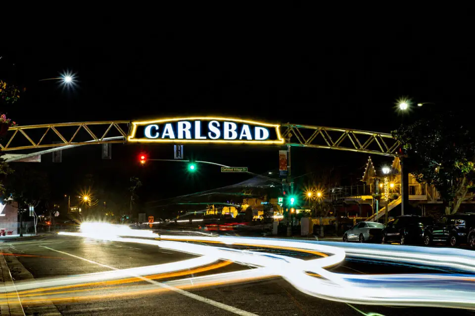 The iconic Carlsbad sign glows at night in the Village. File photo