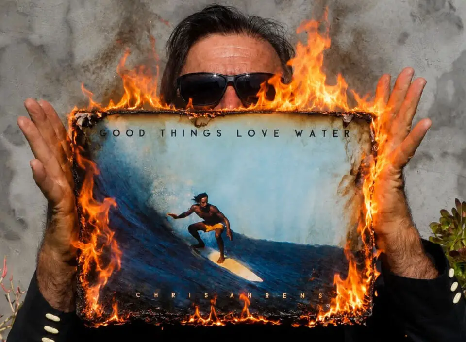 Author and columnist Chris Ahrens holds a copy of "Good Things Love Water." Photo by T-Roc