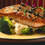 Perfectly seared salmon is served over fresh seasonal greens at Colosseo Cucina Italiana in Solana Beach. The Roman-inspired dish pairs bright, buttery flavors with fresh ingredients for an elegant lunch or dinner. Courtesy photo/Colosseo