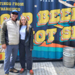 Cold beers and pizza at the Salesforce Park rooftop garden in San Francisco. Author Jeff Spanier, left, and Haley Spanier enjoy a stop during their Bay Area beer tour. Photo by Jeff Spanier