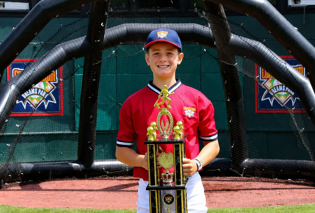 Encinitas Tritons outfielder Jett Fisher holds the King of Swat trophy after winning the home run derby at Cooperstown Dreams Park in Cooperstown, New York. Courtesy photo/Cooperstown Dreams Park