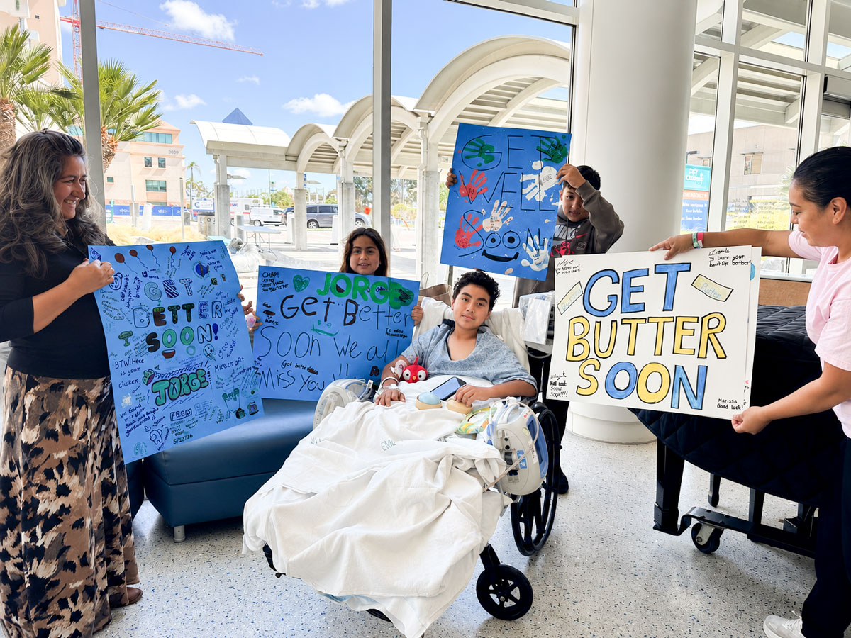 Jorge Sandoval, 12, is surrounded by family and friends during his recovery at Rady Children's Hospital following a May collision involving the e-bike he was riding and a trash truck in Rainbow. The Vallecitos School community has organized a fundraiser to help the family with medical and travel expenses. Courtesy photo
